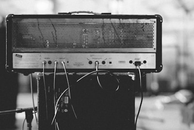 gray and black amplifier on speaker