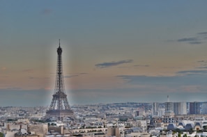 A modern Paris office interior with a view of the city skyline at dusk.