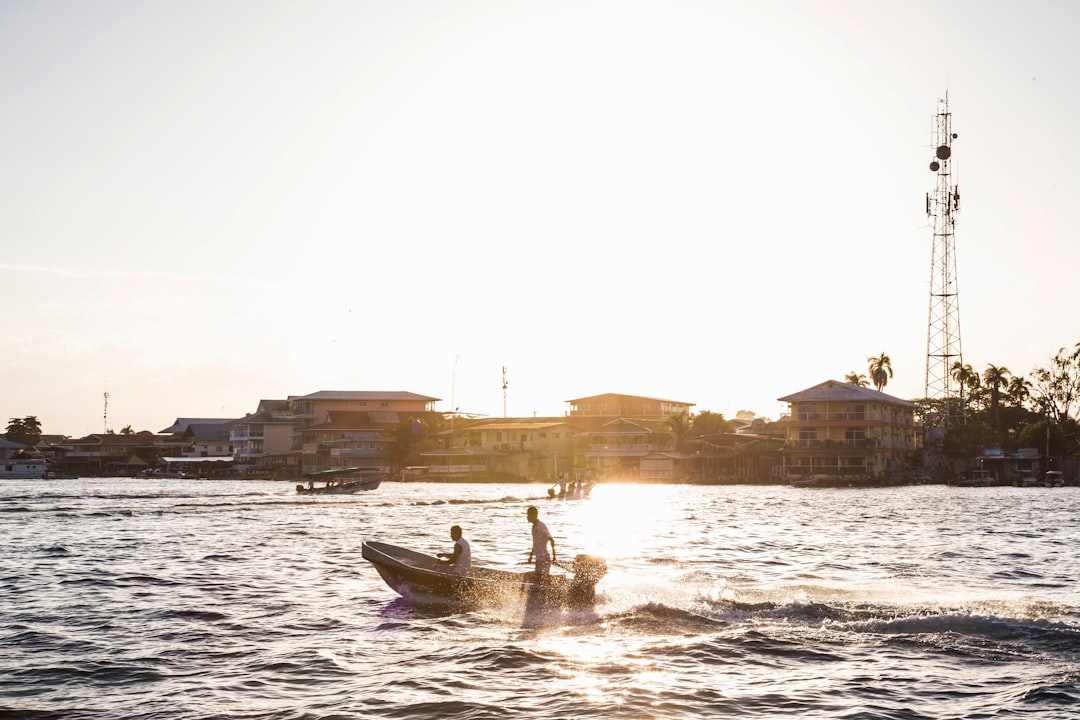 man riding on boat on water during daytime