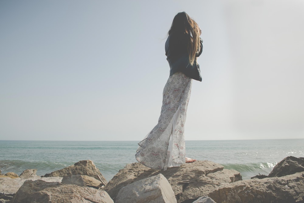 woman standing near the shore