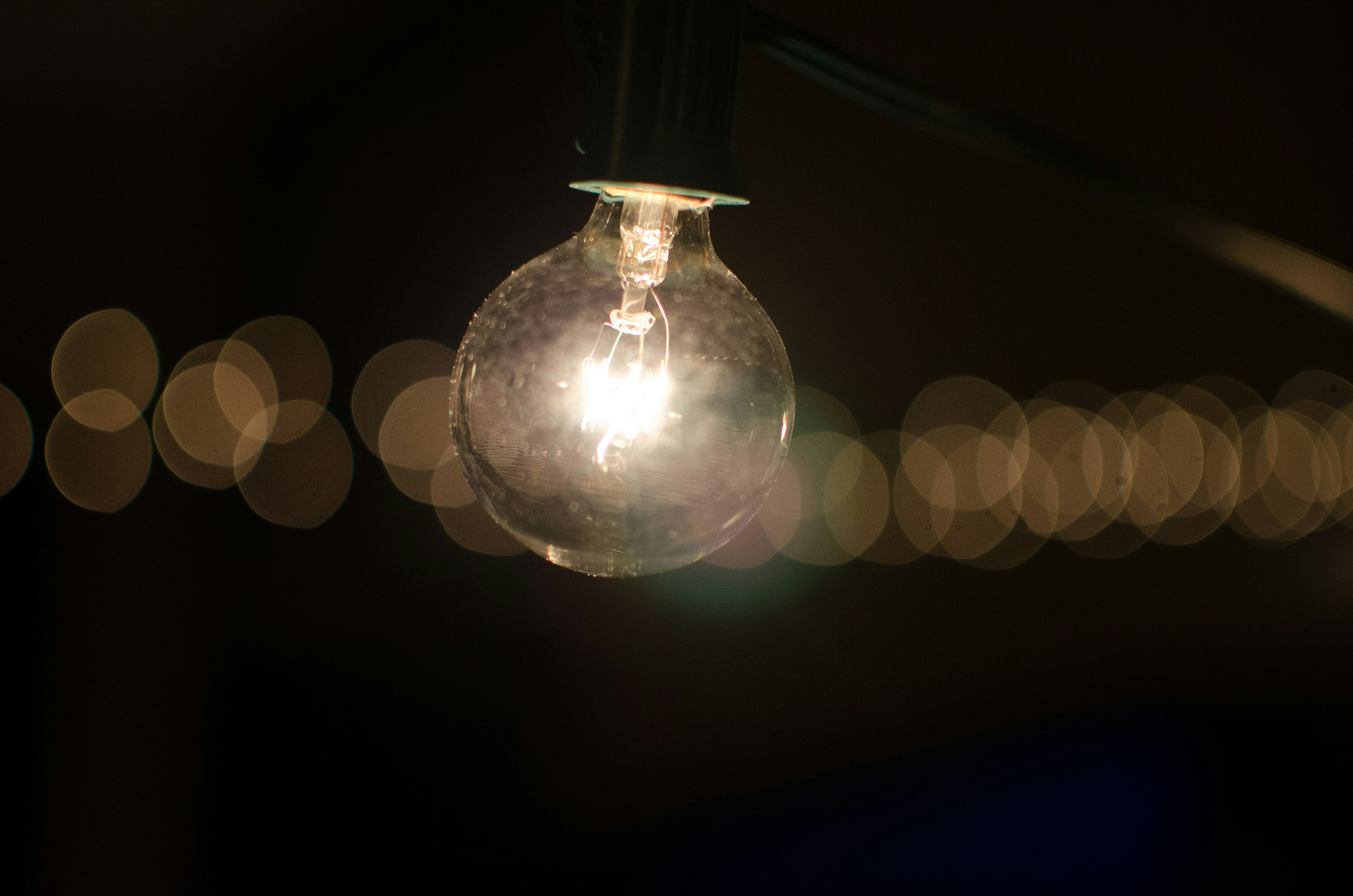 black and clear LED bulb with bokeh lights