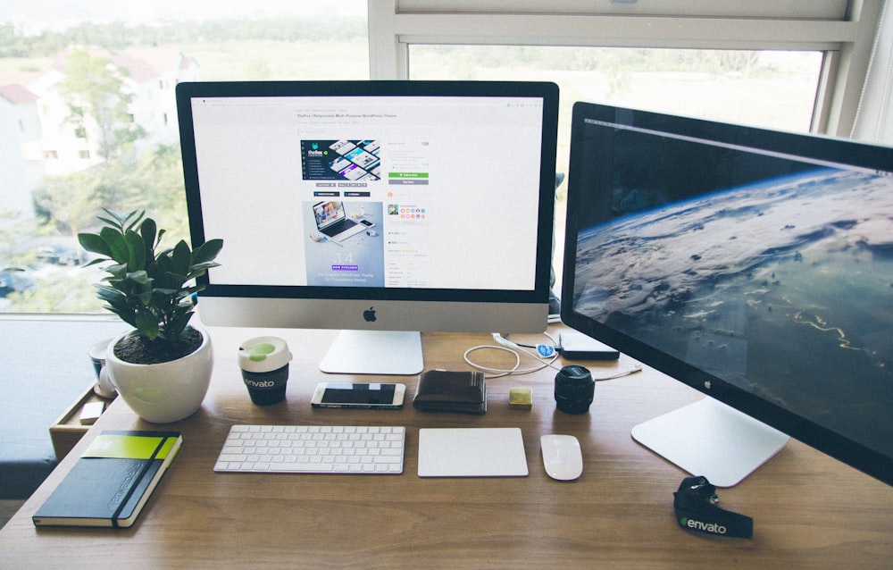 a desktop computer sitting on top of a wooden desk