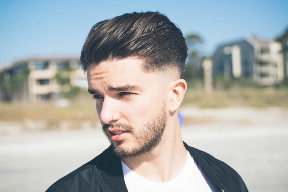 selective focus photography of man wearing black suirt