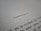 A close-up of a text document with the word 'CAPÍTULO I' centered in bold black letters on a white page. The lower part of the image shows additional text lines, partially visible and fading out of focus.