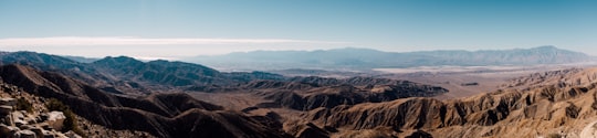 brown mountains under blue sky during daytime in Joshua Tree National Park United States