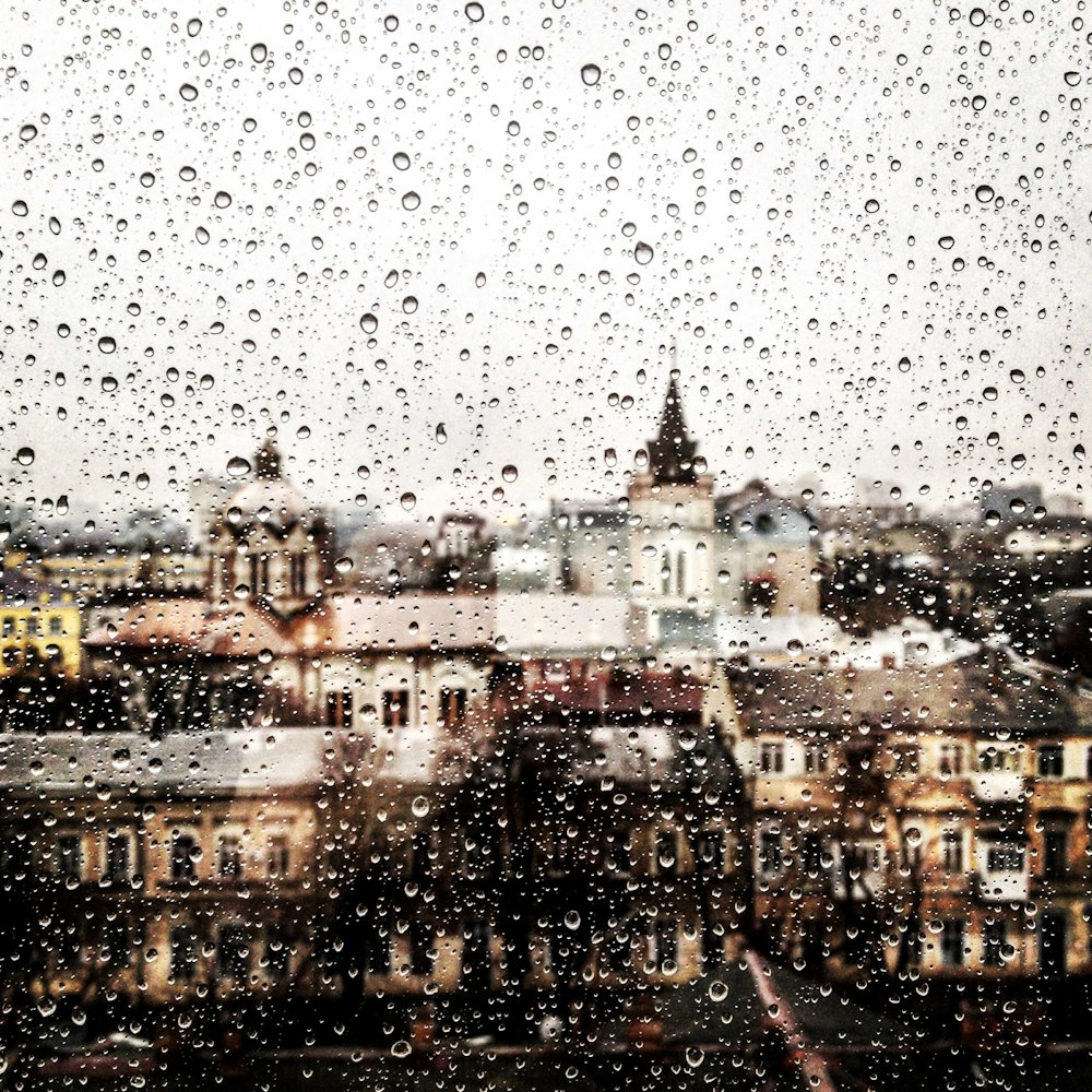 clear glass window with tear drop rain