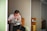 man wearing white top using MacBook