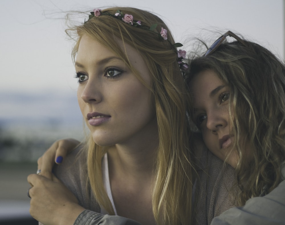 two women close up photography