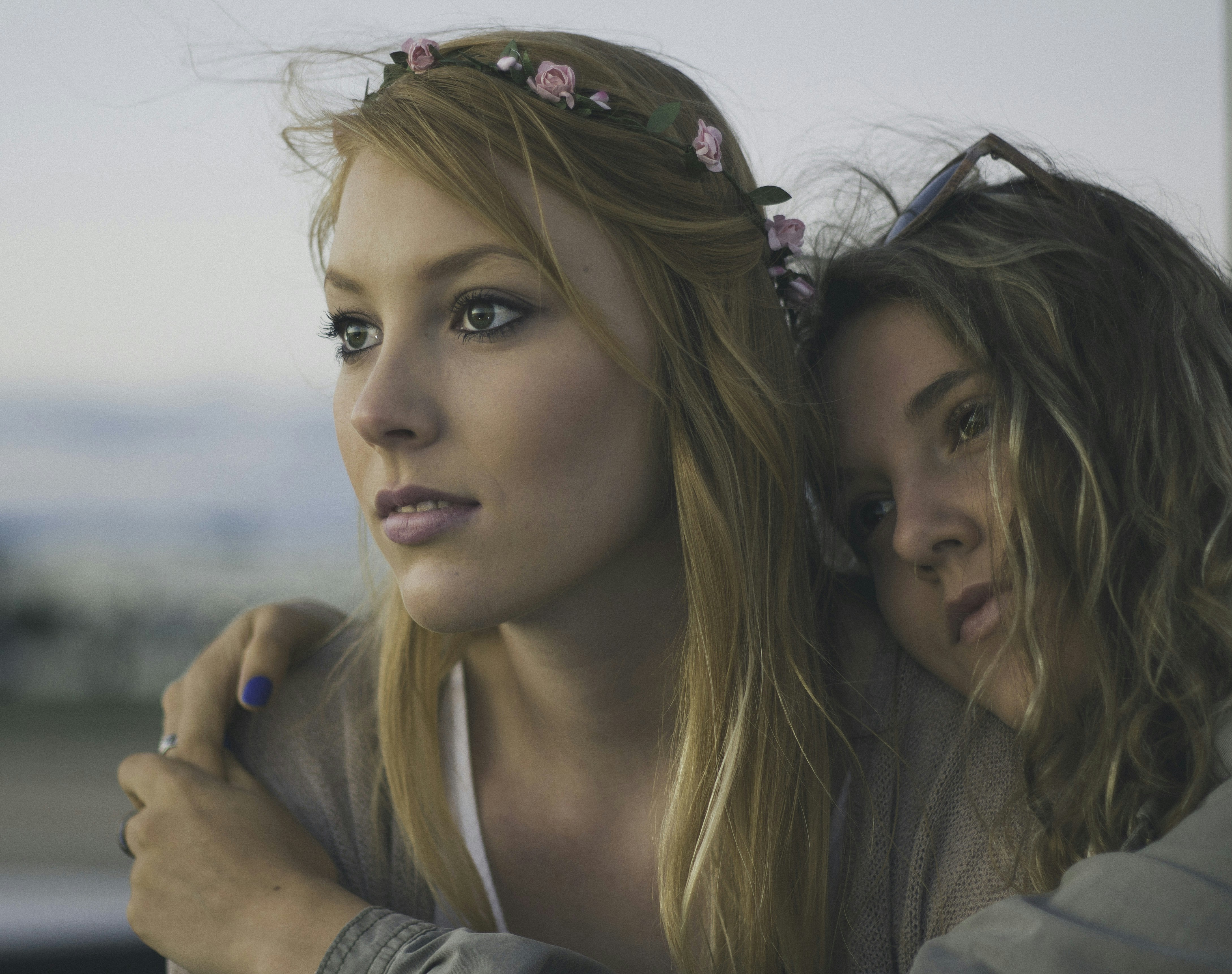 two women close up photography