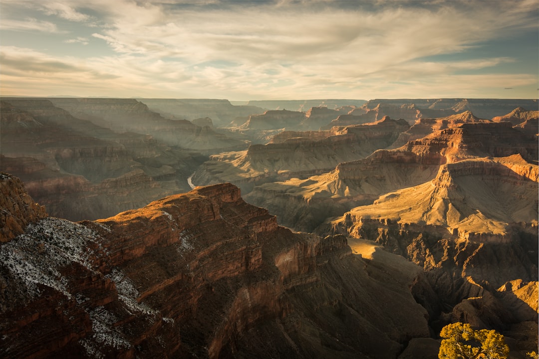 grand canyon below cloudy sky,