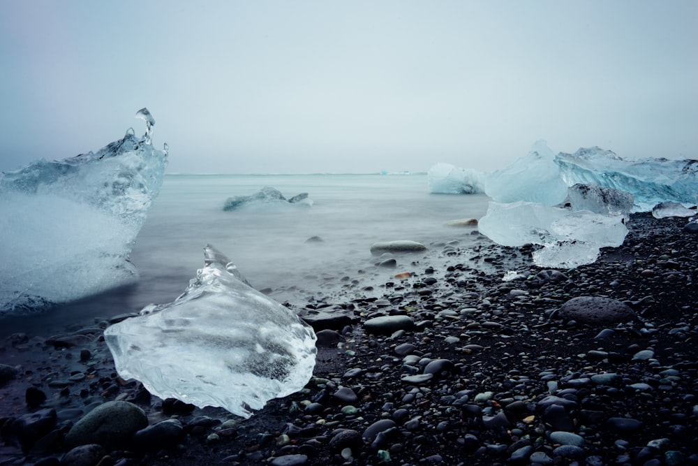 ice blocks on black stone fragment