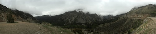 A panoramic view of a misty mountain range covered in dense Atlantic Forest.