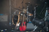 Close-up of the band’s acoustic guitars and harmonicas resting on stage before a wedding gig