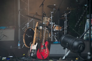 Close-up of the band’s acoustic guitars and harmonicas resting on stage before a wedding gig