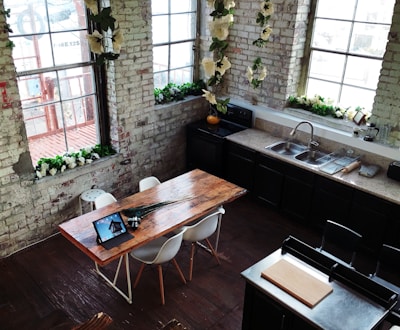 A chic kitchen featuring exposed brick walls and elegant finishes.