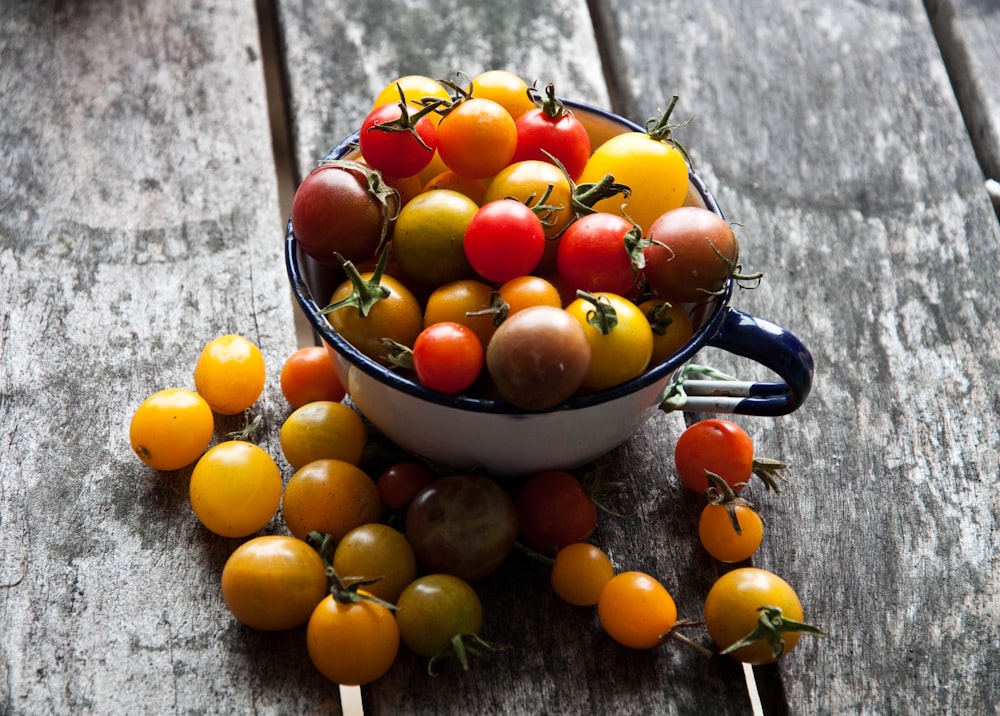 orange fruits in black steel bowl