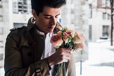 man holding pink roses handsome zoom background