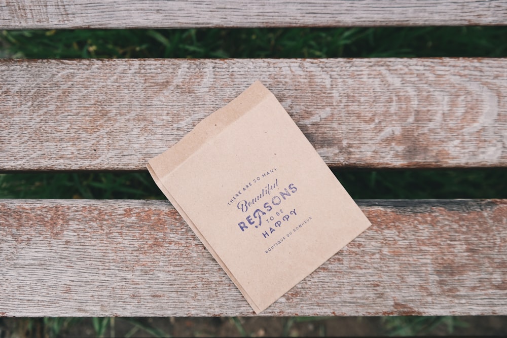 brown printing paper on brown wooden bench