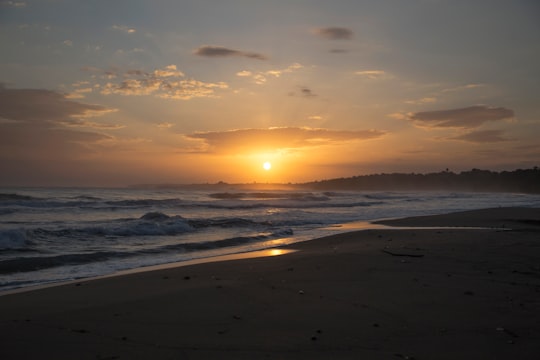 sea waves crashing on shore during sunset in Puerto Viejo de Talamanca Costa Rica