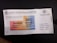 The image features a Malaysian Motor Vehicle License document with a colorful design, displaying the text 'LESEN KENDERAAN MOTOR' along with a vehicle registration number and expiration date. The license has a gradient of orange, blue, and yellow and includes intricate security patterns.