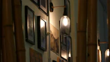 Soft lighting highlighting tasteful artwork on the walls.