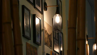 A sleek gallery wall featuring framed urban jazz cityscape prints under warm ambient lighting.