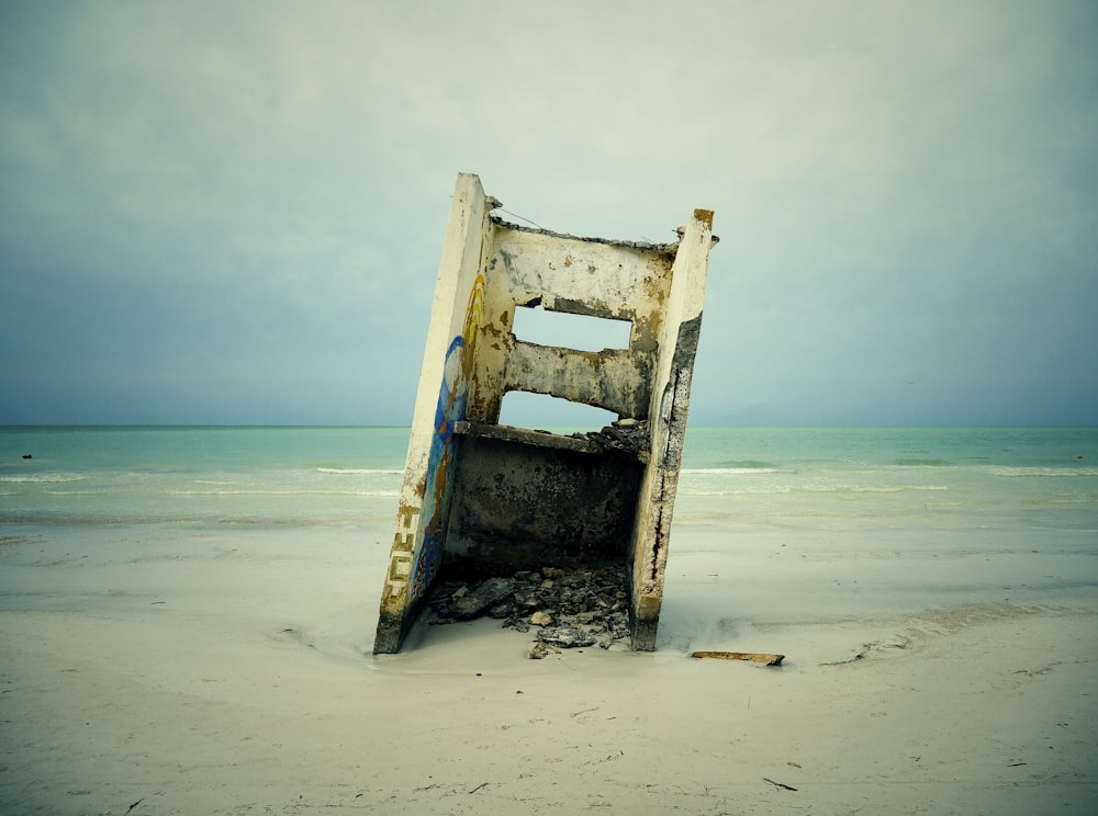 white steel frame near beach shore during daytime