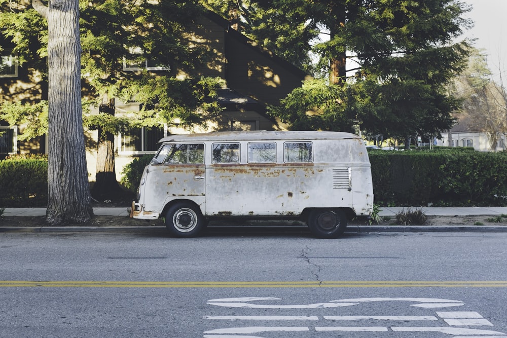 gray bus beside pavement during daytime