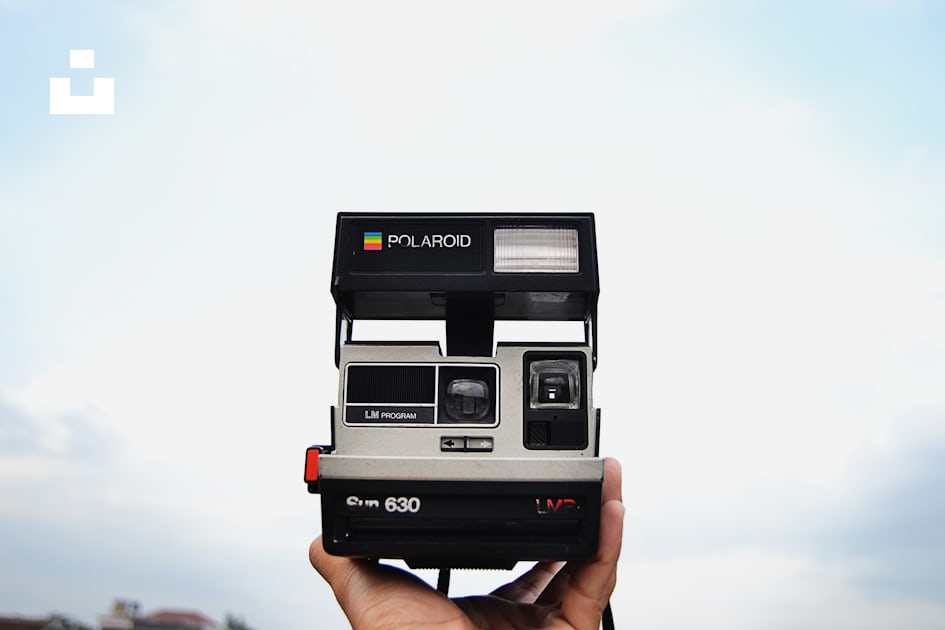 Person holding black and gray Polaroid 630 instant camera photo – Free  Camera Image on Unsplash
