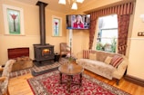 A cozy living room with a heating system in use.