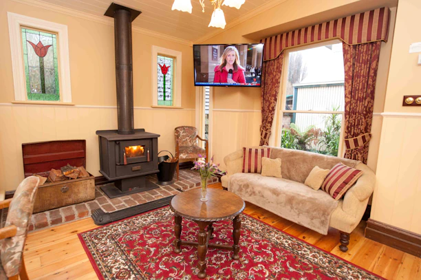 A cozy living room with a modern heating system glowing warmly.