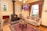 A cozy living room featuring a beautifully crafted wool rug.