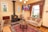 A cozy living room featuring a beautifully crafted wool rug.