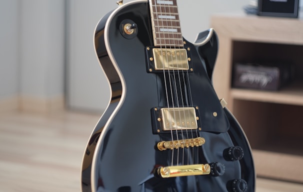macro shot photo of black electric guitar