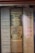 A row of vintage hardcover books with visible spines. Titles include 'Yankee Priest' by Edward F. Murphy, 'Basic History of the United States' by Charles A. and Mary R. Beard, and 'Three Detective Novels' by John Dickson Carr. The books are neatly arranged and display a variety of muted colors and classic typography.