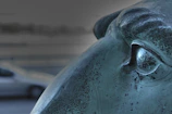 Close-up of a bronze sculpture showing intricate textures and patina.