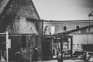 Black and white photo of Peter B. Perri Jr. overseeing a construction site in the 1980s