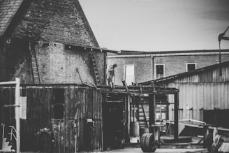 Black and white photo of Peter B. Perri Jr. overseeing a construction site in the 1980s