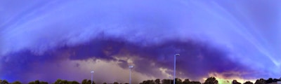 A dramatic thunderstorm cloud over Fürstenfeldbruck with dark skies