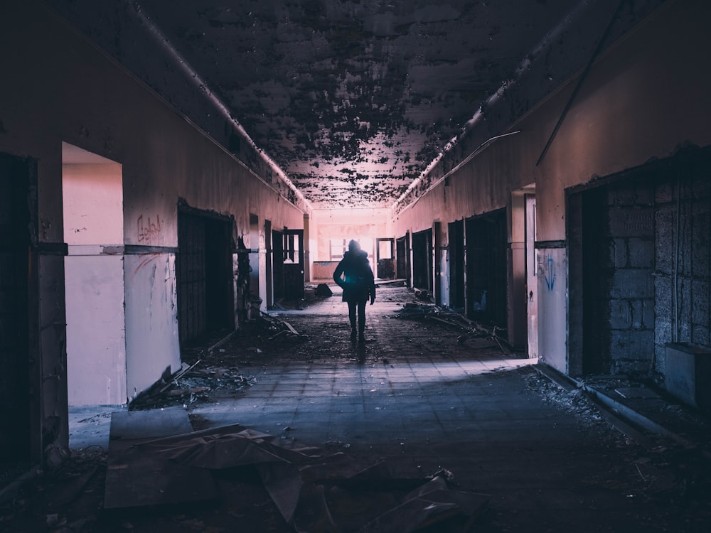 person walking on hallway of building