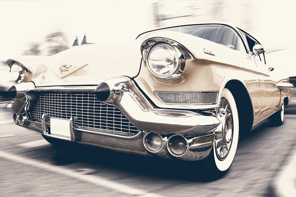 gold vintage car in macro shot photography