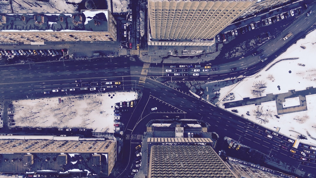 aerial photography of road between buildings