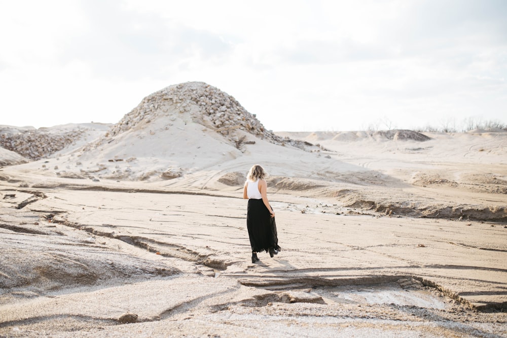 person walking on desert