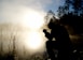 silhouette of kneeling man