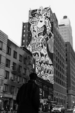 A finished mural displayed proudly in a lively urban setting.