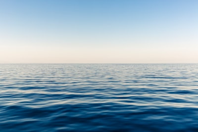 blue ocean water during daytime sea zoom background