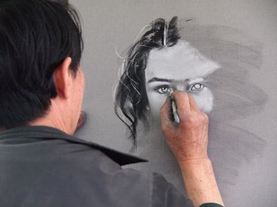 man sketching portrait of woman talented zoom background