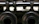 Close-up of a stainless steel E-type retaining ring securely fitted on a mechanical shaft.