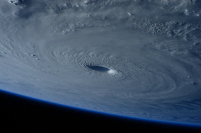 Wide shot of Saturn with the hexagonal storm clearly visible at the north pole.