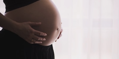 woman holding stomach